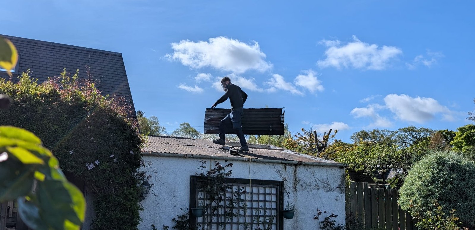 Cycling Handyman Doug Home Maintenance and Installations working on a roof in Edinburgh